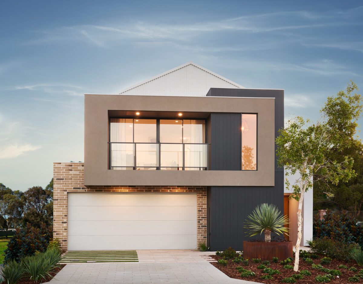 The Art House display home facade at dusk with gable roofline and double garage