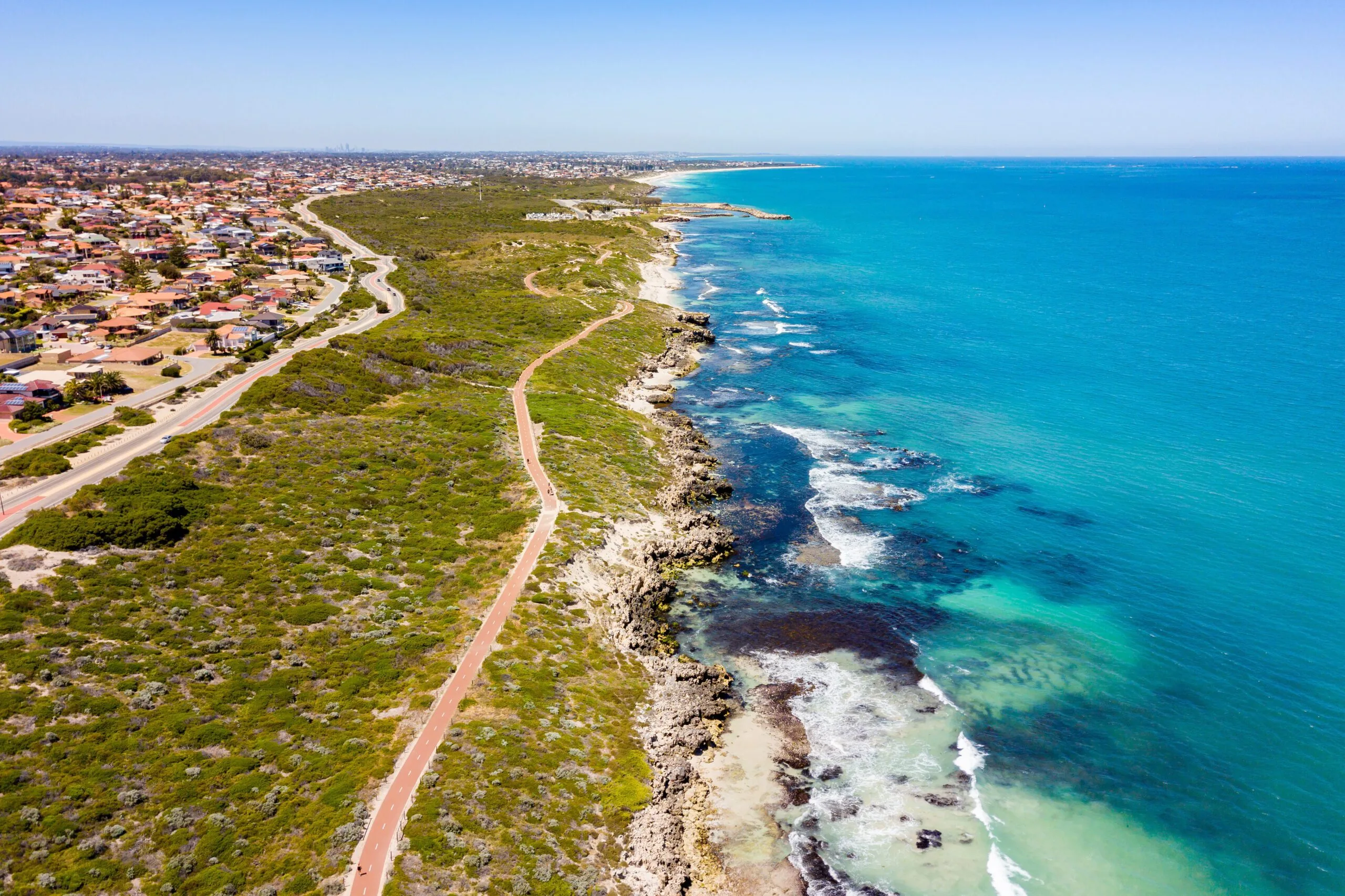 Birds eye view of Iluka showing the coast and homes of the safe Perth suburb