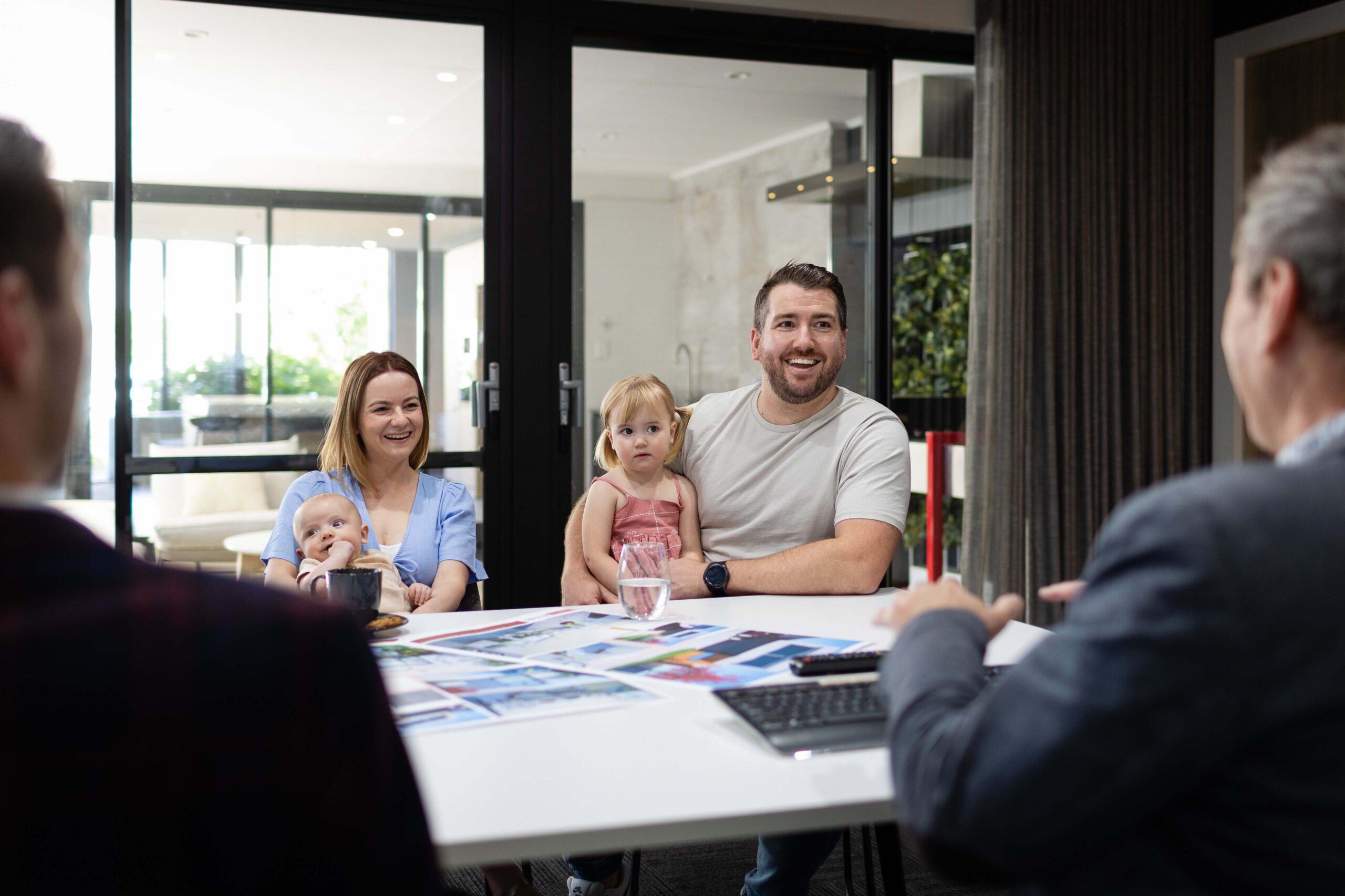 Family discussing home plans with a Residential Attitudes consultant