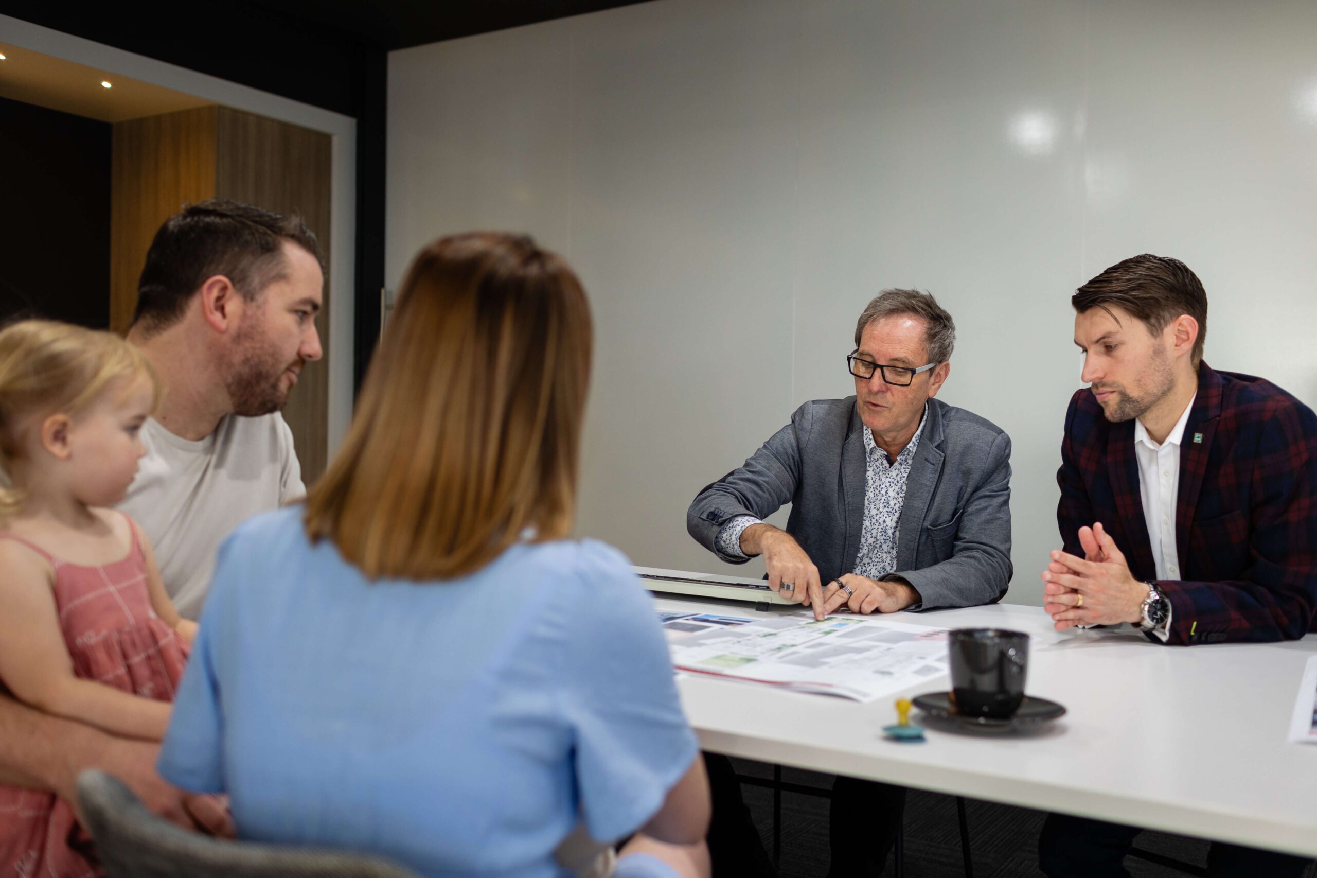 Couple and child meeting Residential Attitudes consultants in the design studio