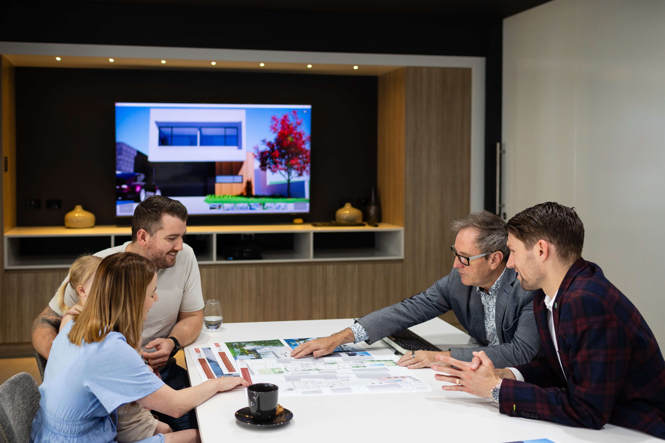 Family meeting Residential Attitudes consultants to review home plans