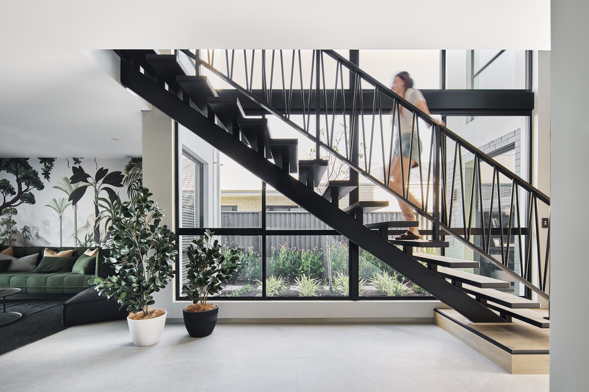 Staircase with botanical wall mural in a Residential Attitudes display home