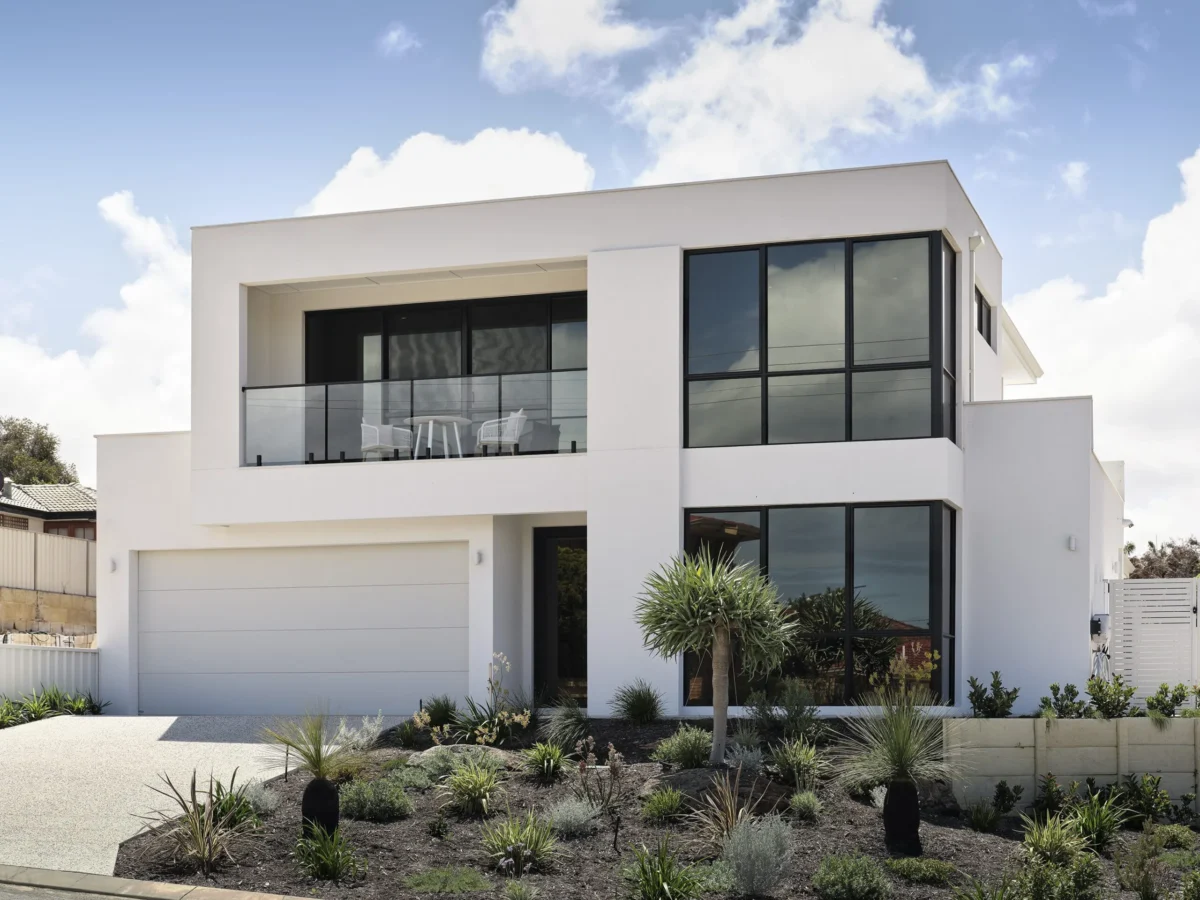Front facade of a double storey client home with expansive windows