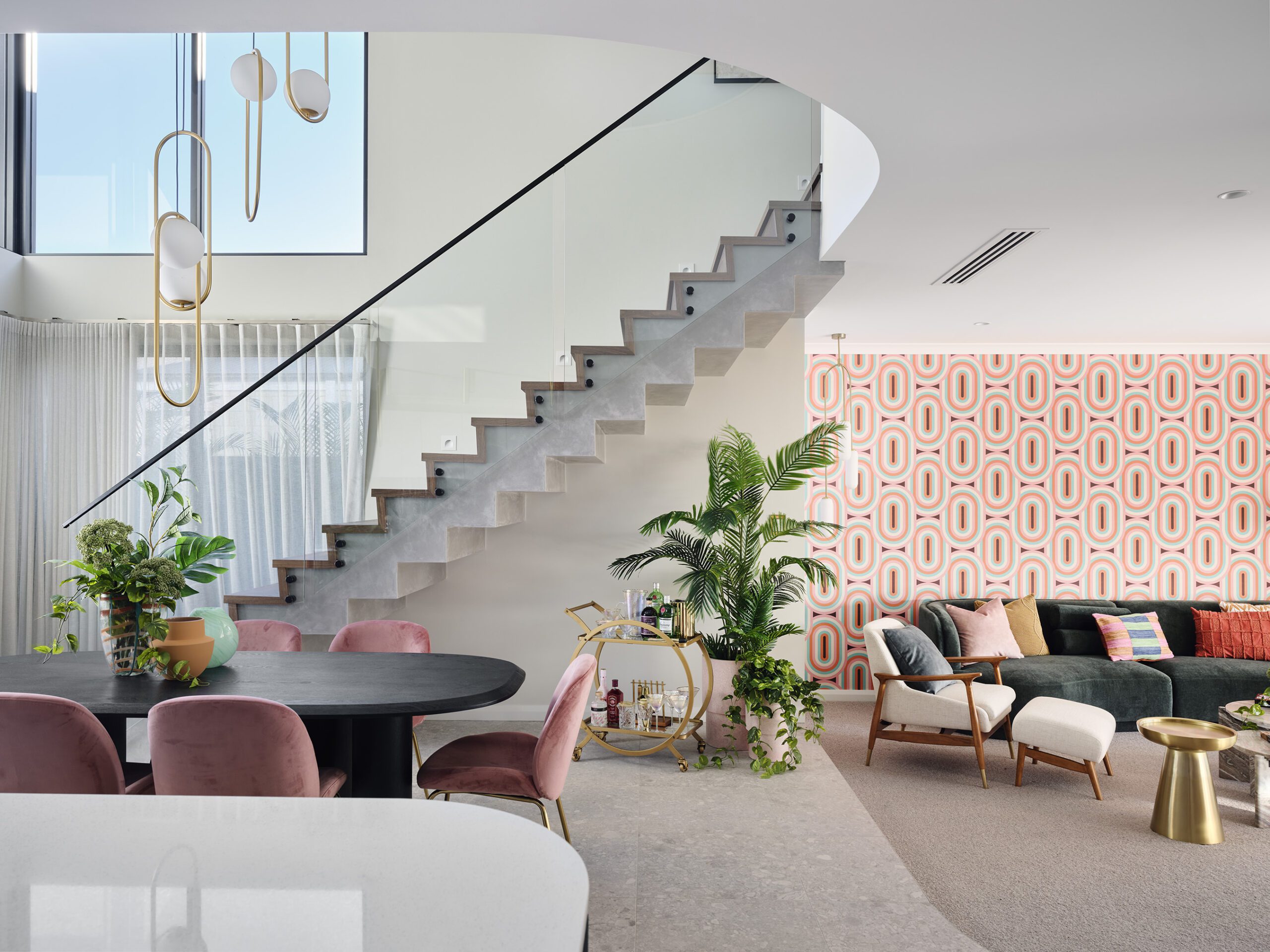 Curved staircase beside a patterned feature wall in a Residential Attitudes display home
