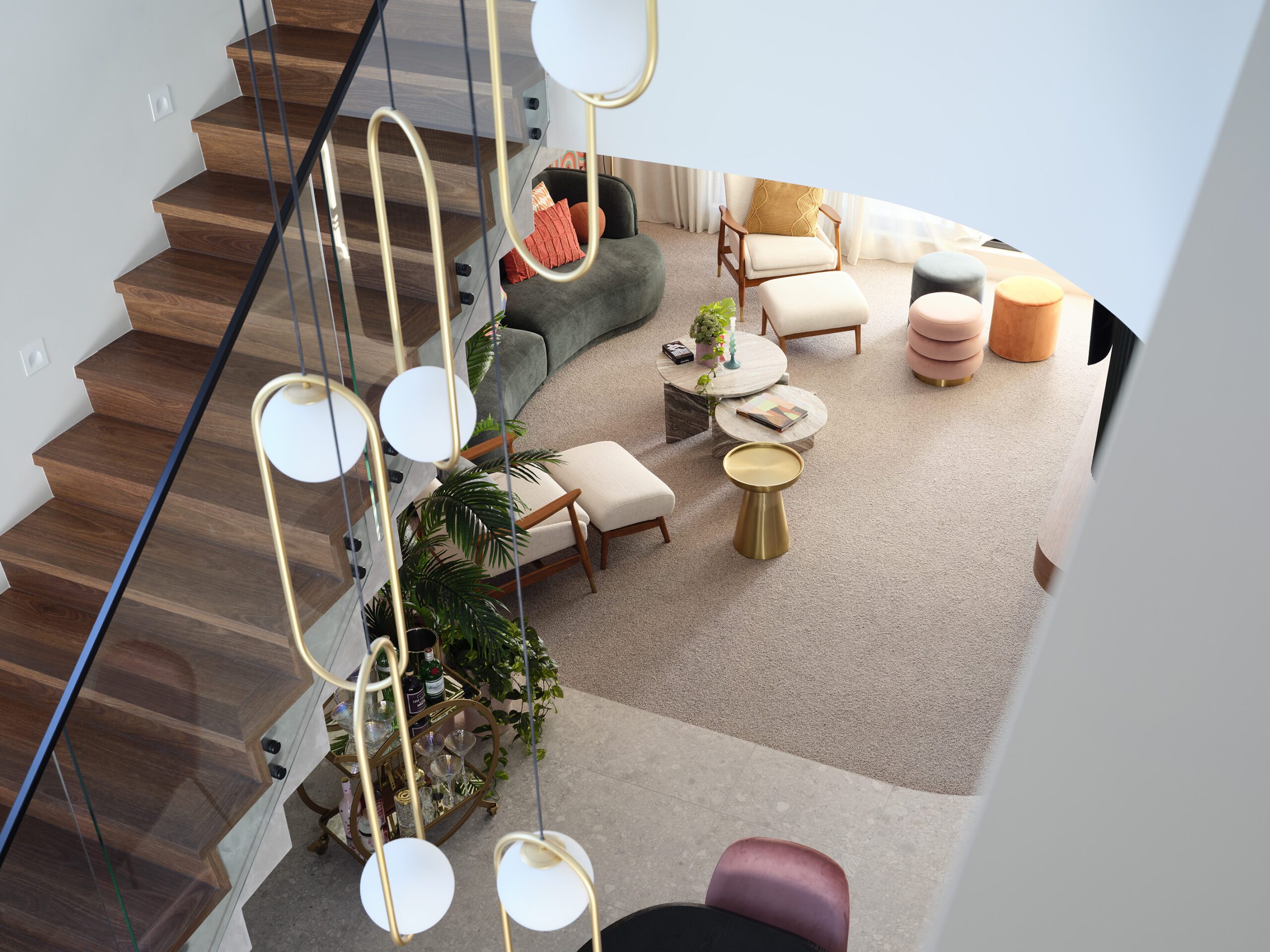 Custom homes with attitude, built by Resiential attitudes. Featuring concrete-style floating staircase, curved wall voids, and impactful light pendants to suit your lifestyle.