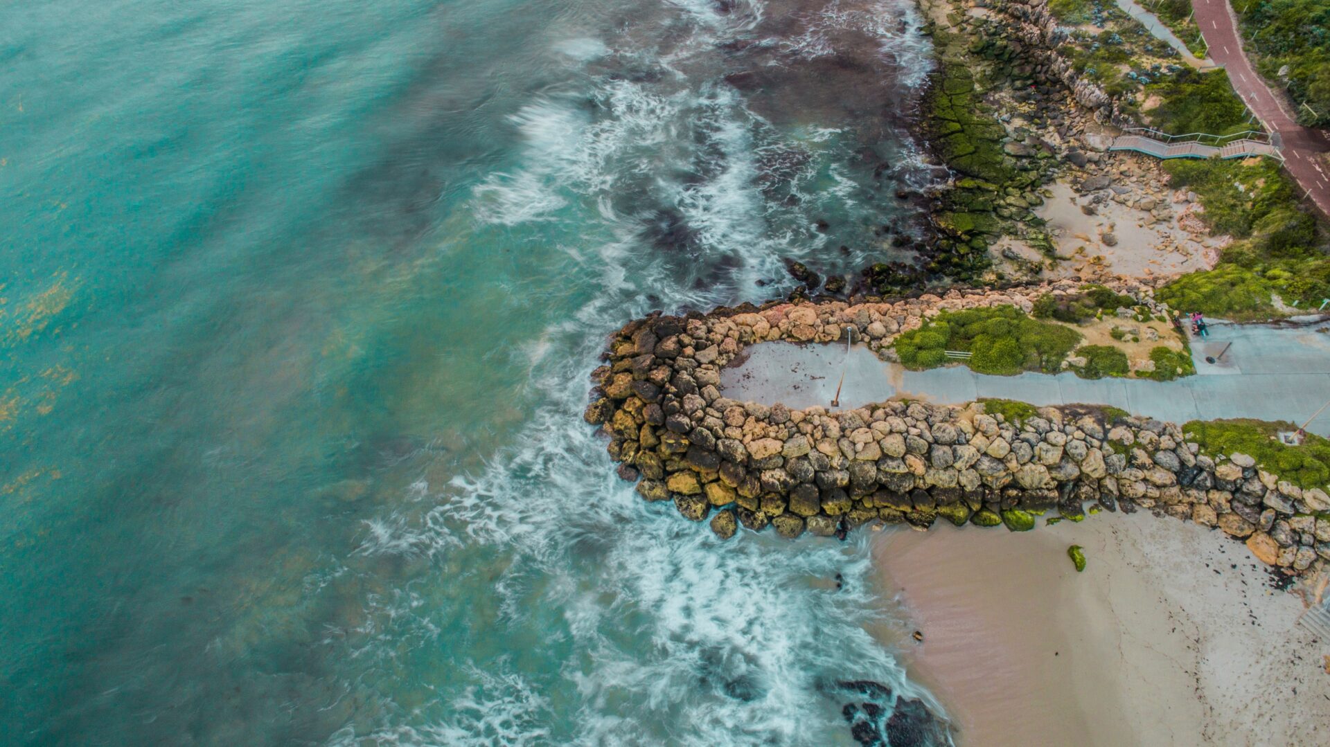 An aerial drone shot of Burns Beach, Western Australia, one of the safest places to build a house in Perth