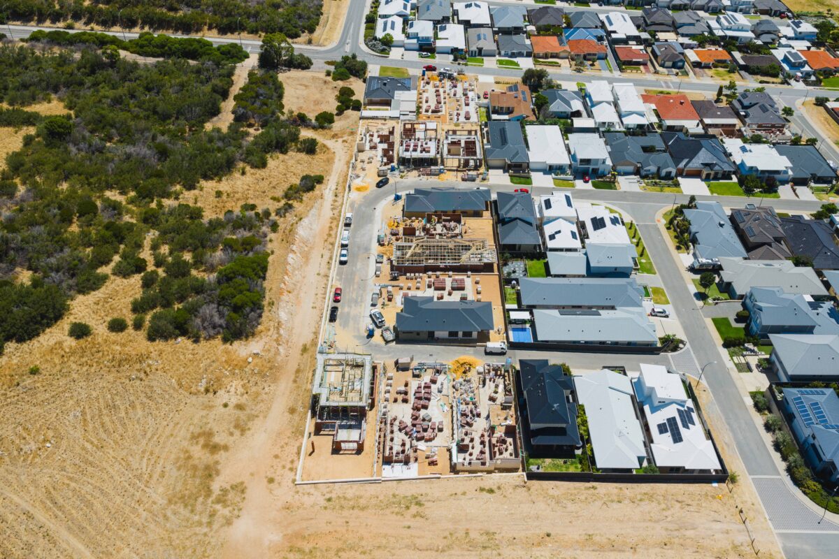 The photo shows an aerial view from a drone, showing an in-progress Residential Attitudes client home that sits across from dunes and greenery, in Coogee, south of Perth. This positive review and testimonial is for their building experience with Residential Attitudes.