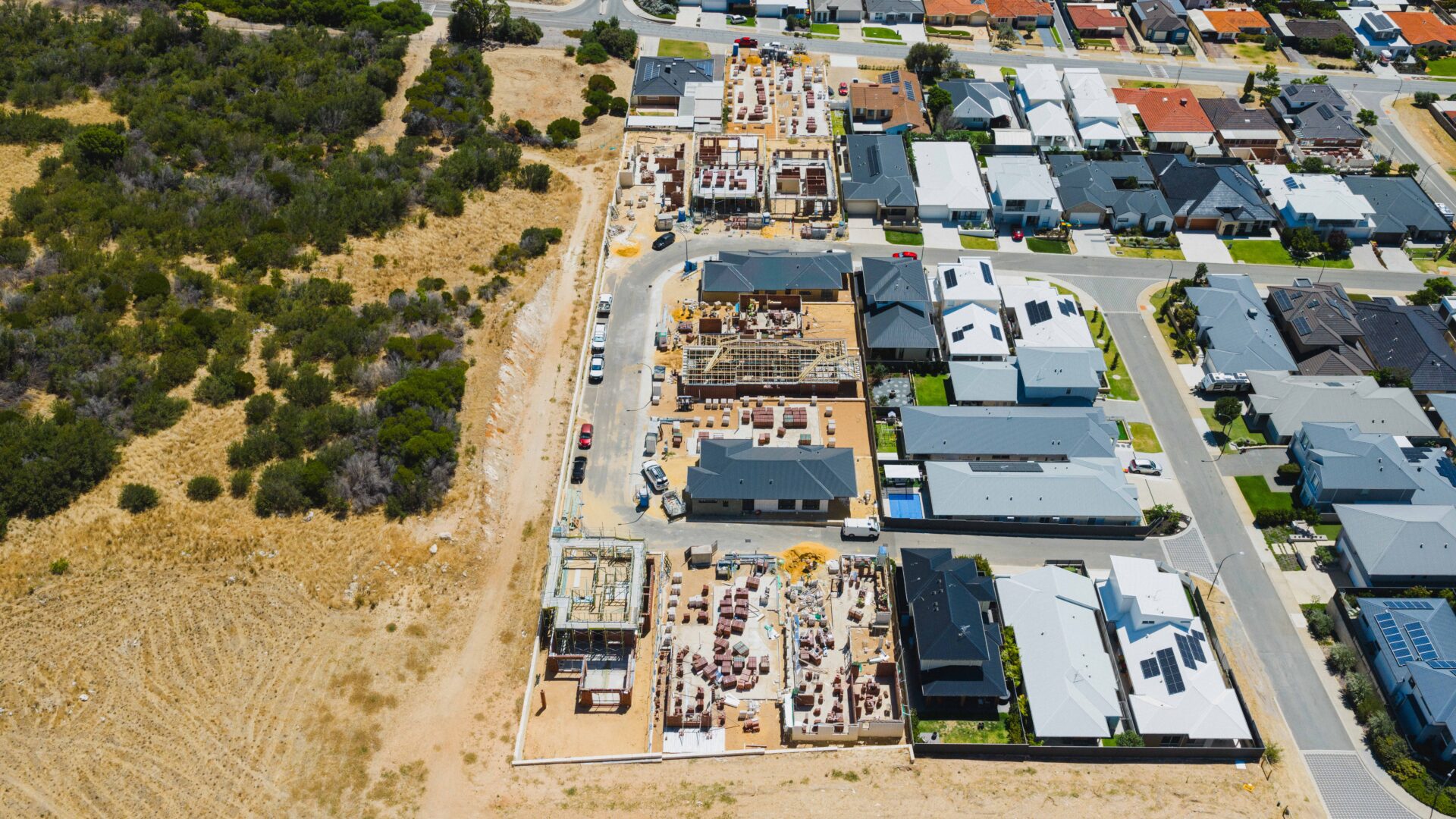 The photo shows an aerial view from a drone, showing an in-progress Residential Attitudes client home that sits across from dunes and greenery, in Coogee, south of Perth. This positive review and testimonial is for their building experience with Residential Attitudes.
